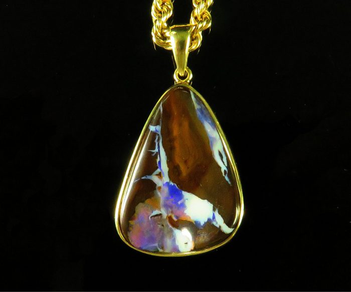 Free Form Boulder Opal in Gold Pendant
