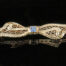 Edwardian Platinum and Gold Sapphire Filigree Bow Brooch