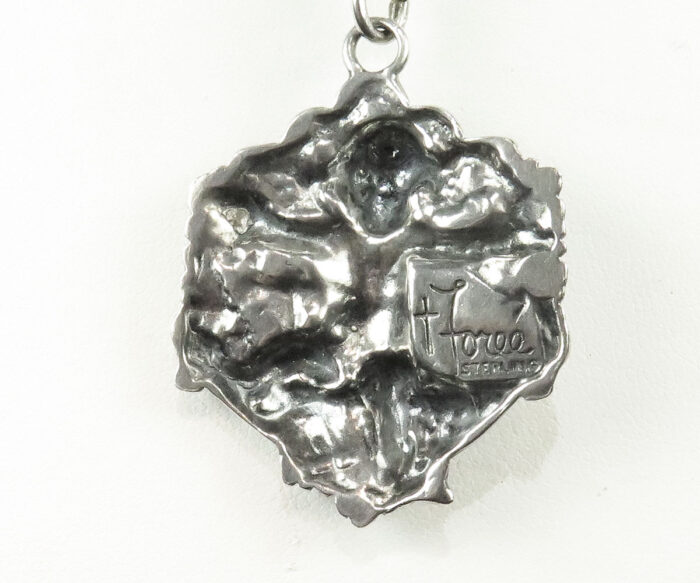 Sterling cherub pendant by T. Foree